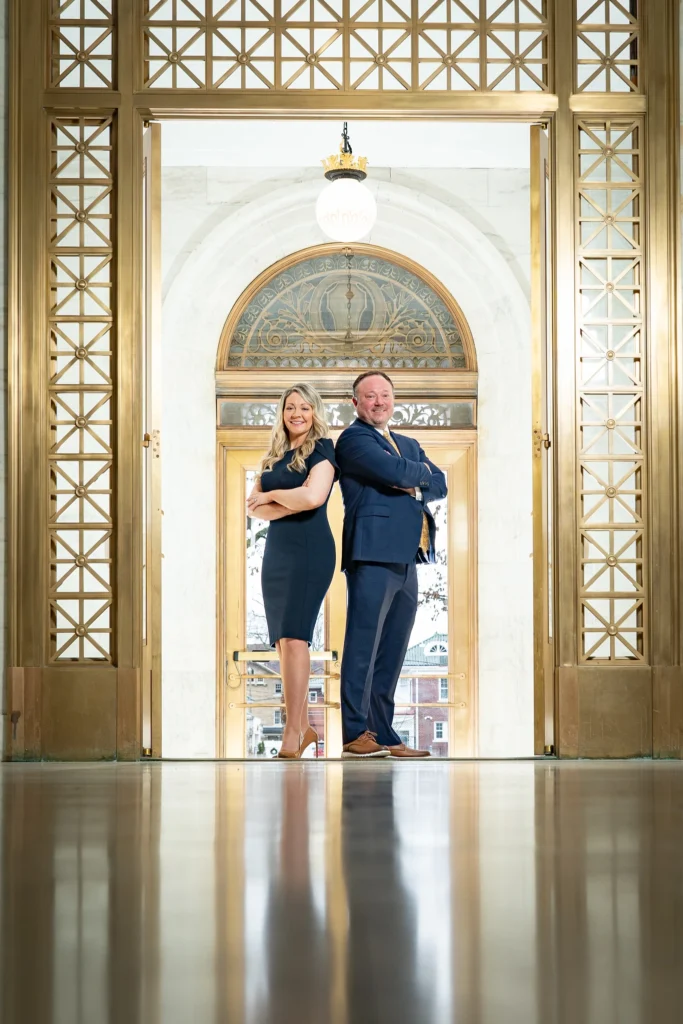 Summer and Daniel in State Capitol in front of doors