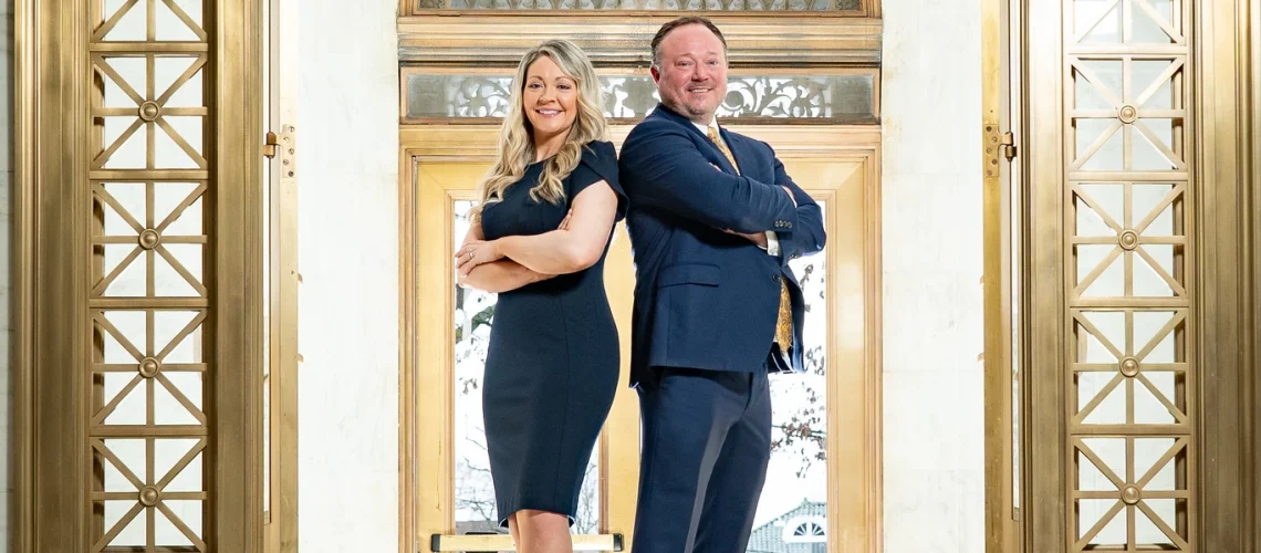 Summer and Daniel in State Capitol in front of doors